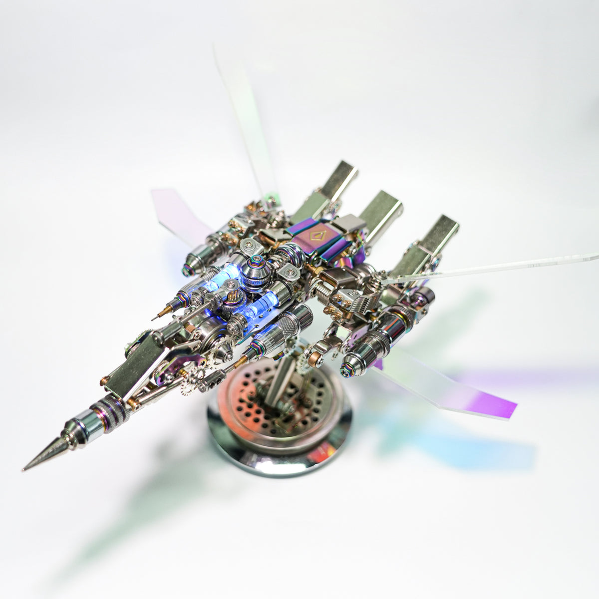 Metallic model of a spaceship with glowing elements on a white background