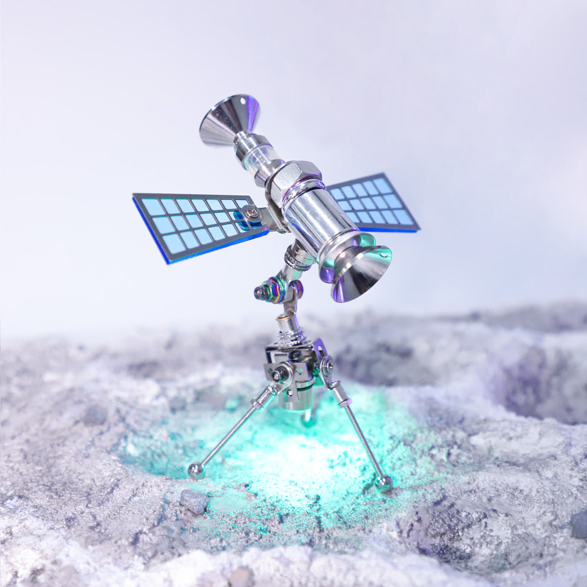 Model of a satellite on a snowy landscape