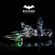 Toy motorcycle with Batgirl figure on a dark background, featuring the Batgirl logo above.