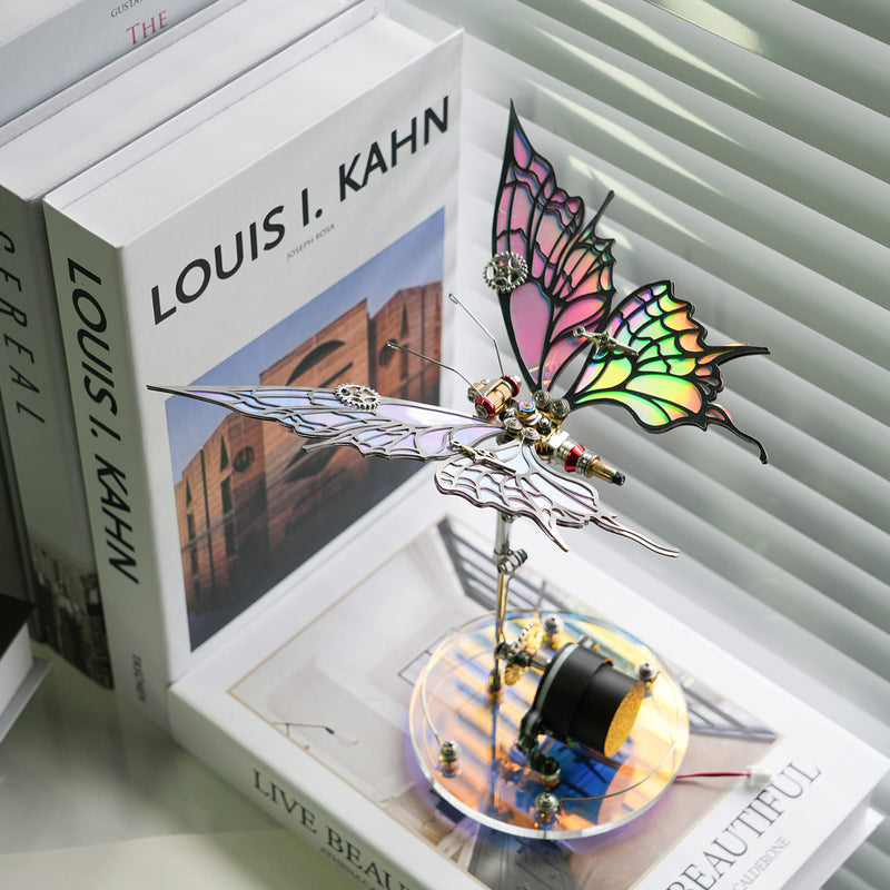 Decorative butterfly sculpture on a book titled 'Louis I. Kahn'.