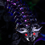 Close-up of a mechanical device with glowing red elements on a dark background