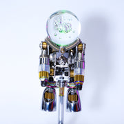 Toy robot with a clear glass ball head on a white background