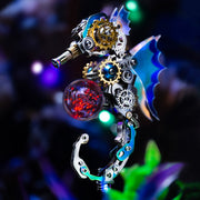 Decorative key with mechanical design and glowing red sphere on a dark background
