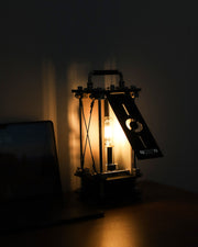 Vintage-style lamp with a glowing light bulb in a dark setting