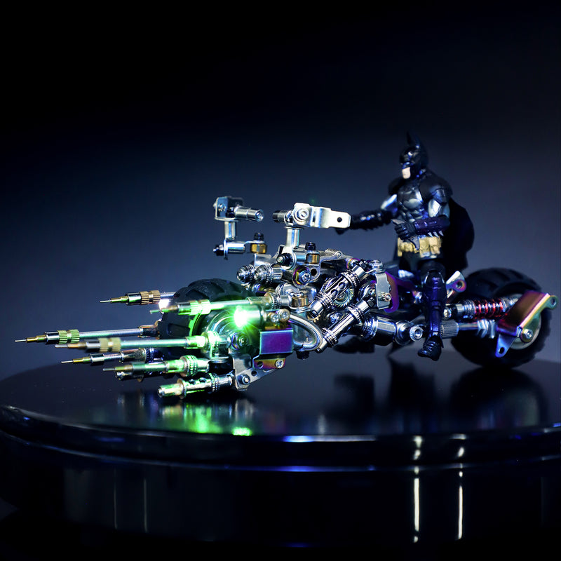Toy figure of a superhero on a motorcycle with glowing elements against a dark background