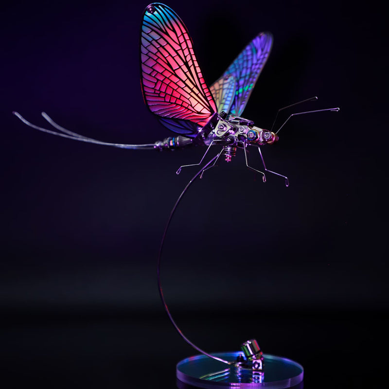 Colorful dragonfly-shaped lamp on a black background