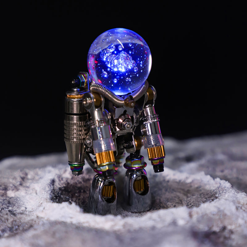 Metallic robot figure with a glowing blue sphere on a textured surface