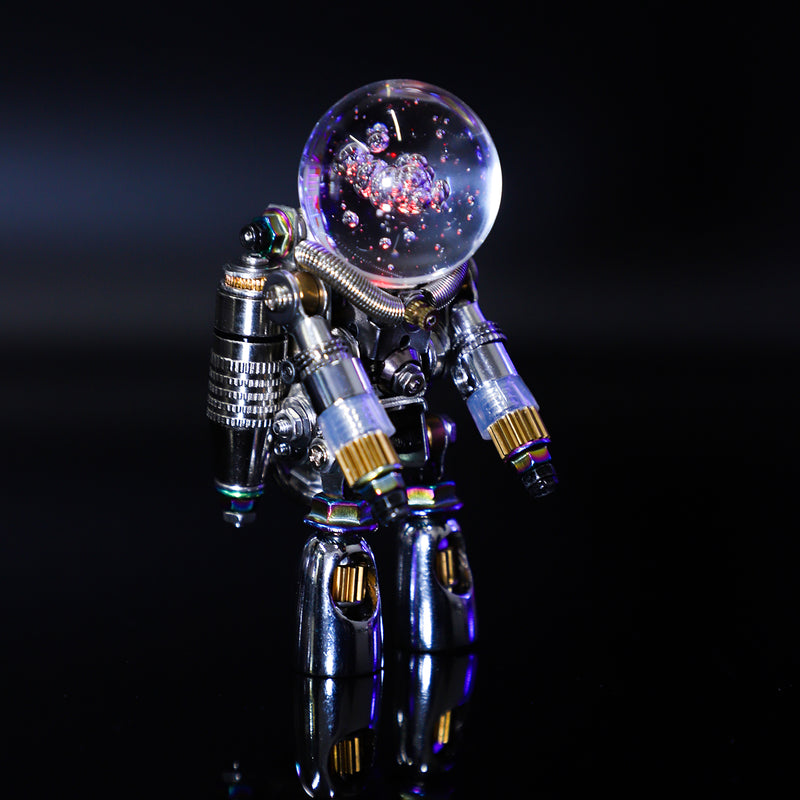 Metallic robot figure with a crystal ball on a reflective surface