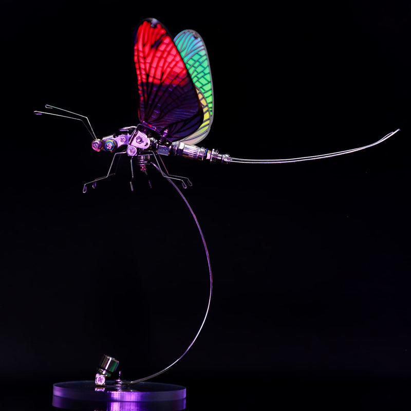 Colorful dragonfly-shaped lamp on a black background