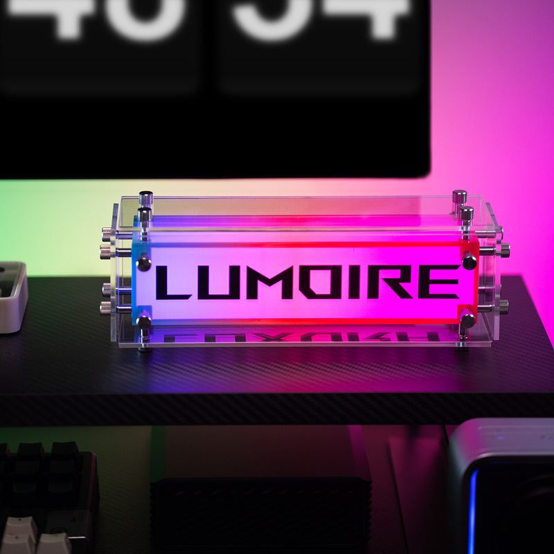 LUMOIRE product with colorful gradient on a desk