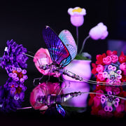 Colorful butterfly-shaped LED light with flowers in the background