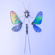Artificial insect with colorful wings on a light blue background