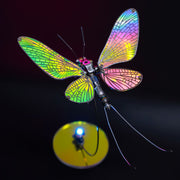 Colorful dragonfly-shaped object with a dark background