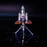 Model rocket on a stand with a dark background