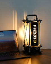 Lamp with a brand logo next to a laptop on a desk