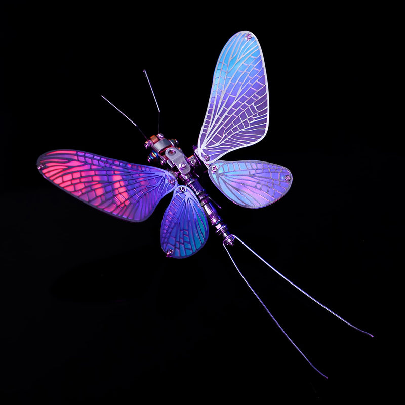Dragonfly-shaped toy with glowing purple and blue wings on a black background