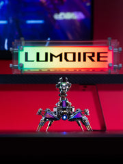 Metallic robot-like sculpture on a red platform with 'LUMOIRE' branding in the background.