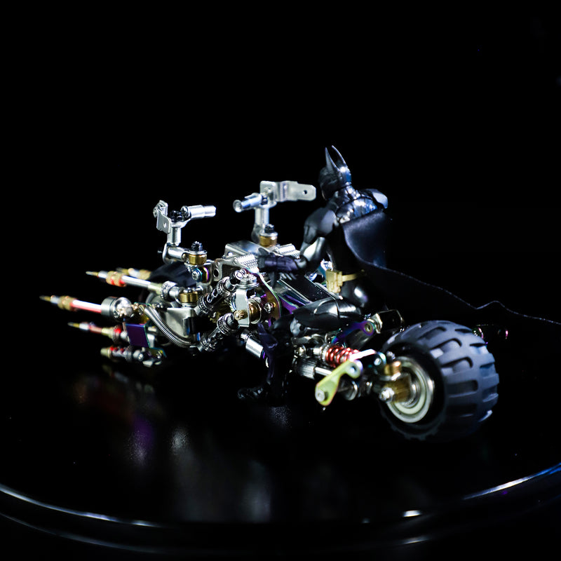 Toy robot on a reflective black surface with a dark background