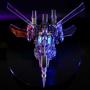 Mechanical model with glowing lights on a dark background