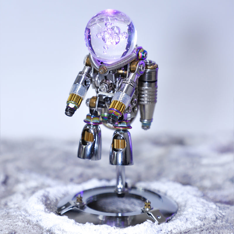 Metallic robot figurine on a textured surface with a blurred background
