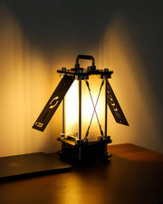Mechanical lamp with glowing light on a dark background