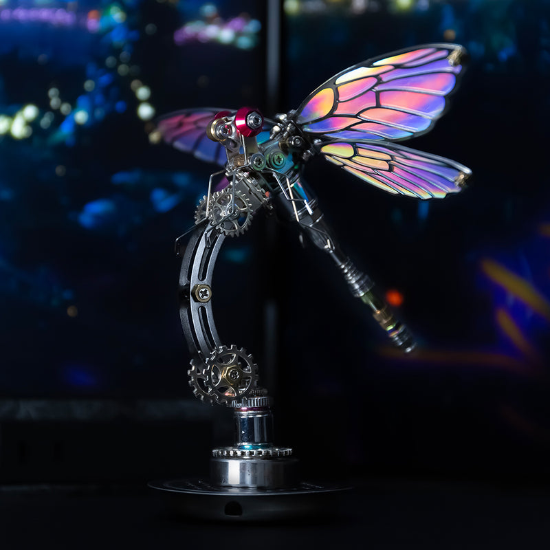 Decorative dragonfly sculpture with colorful wings on a dark background