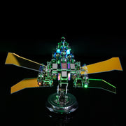 Toy robot with green lights on a black background