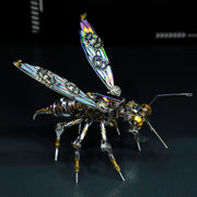 Metallic insect sculpture with intricate design on a dark background