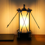 Mechanical device on a wooden surface with a warm glow