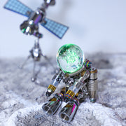 Metallic astronaut figure on a moon surface with a space station in the background