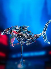 This image features a striking model of a hammerhead shark, crafted with intricate detailing and a vibrant color palette. The sculpture captures the dynamic form of the hammerhead shark, emphasizing its distinctive head shape and sleek body.
