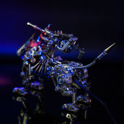 Metallic dragon sculpture with intricate details on a dark background