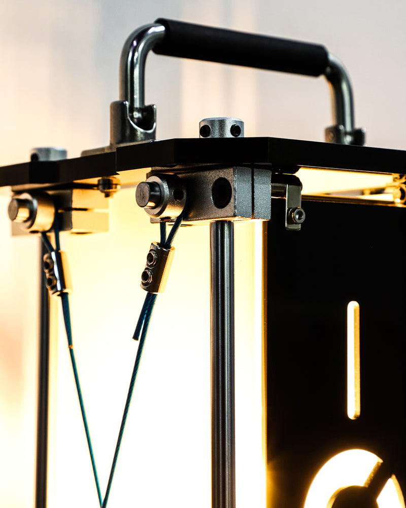 Close-up of a mechanical device with metal components and wiring.