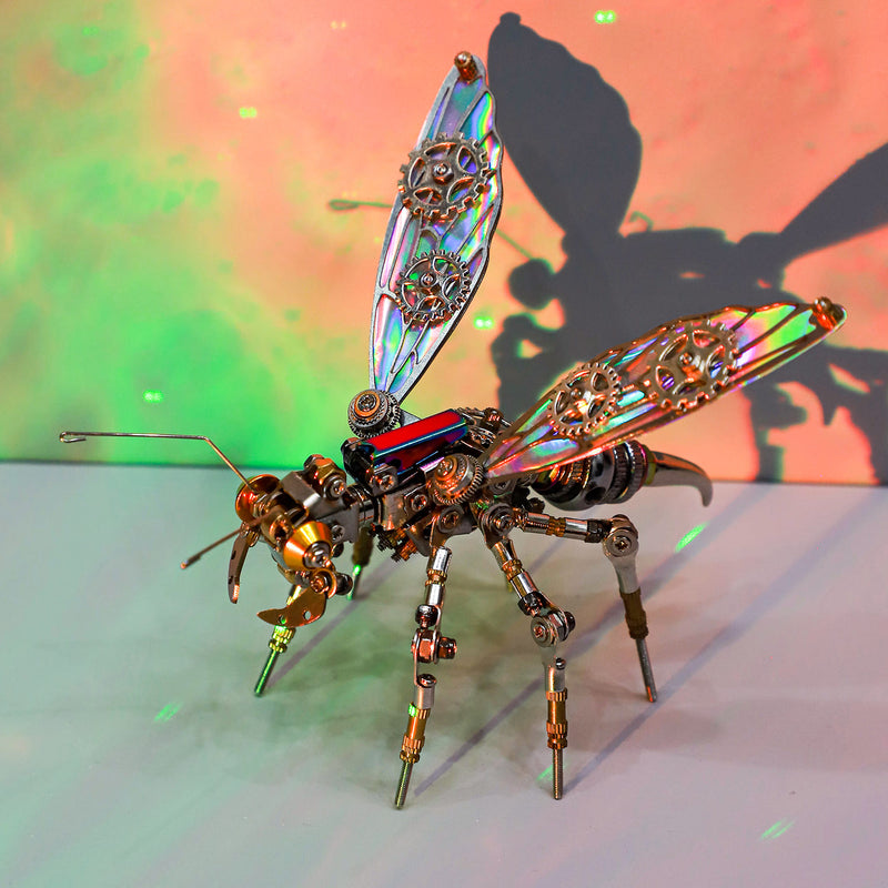 Metallic insect sculpture with iridescent wings on a colorful background