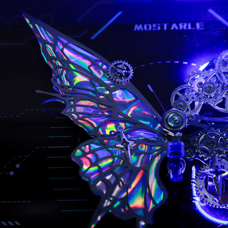 Metallic butterfly with gears on a dark background, featuring the brand 'MOSTARLE'.