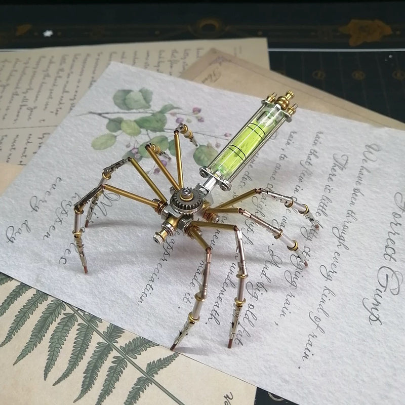 Metal spider sculpture on vintage paper with botanical illustrations