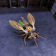 Mechanical insect model with gears on a dark blue surface